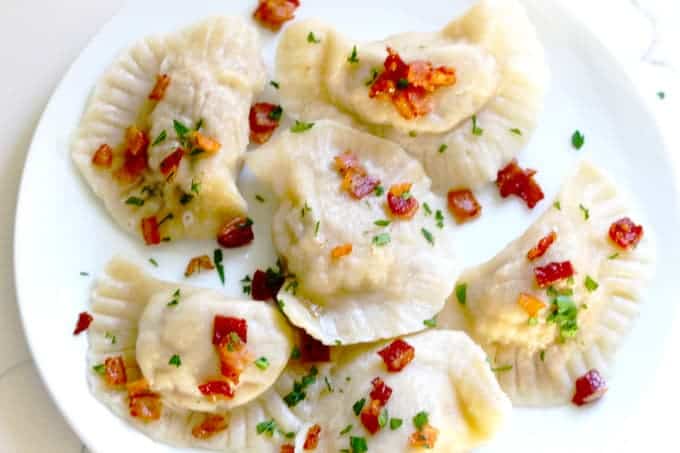 White plate filled with pierogi