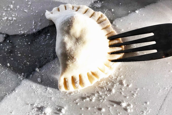 Sealing pierogi with the fork