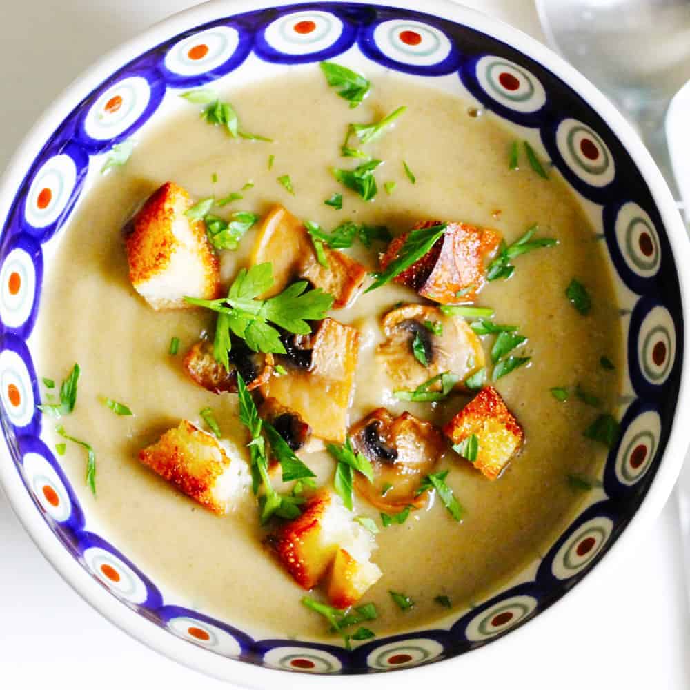Cream of Mushroom Soup with Croutons and sliced mushrooms in a bowl