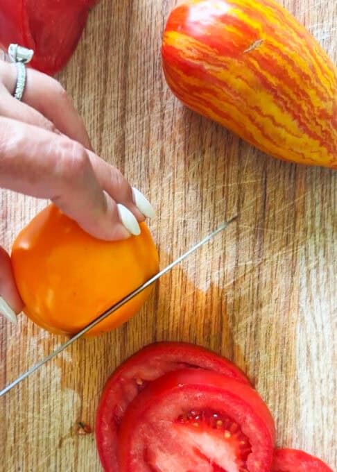 Heirloom tomatoes being sliced