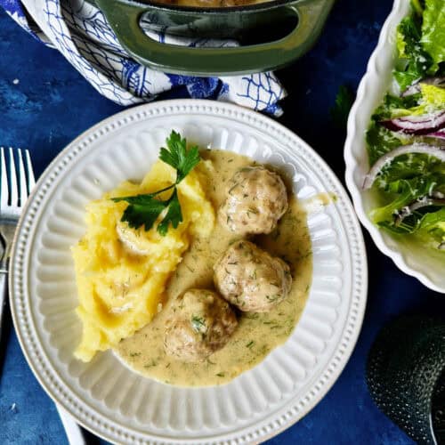 Overhead of boiled meatballs and mash potatoes