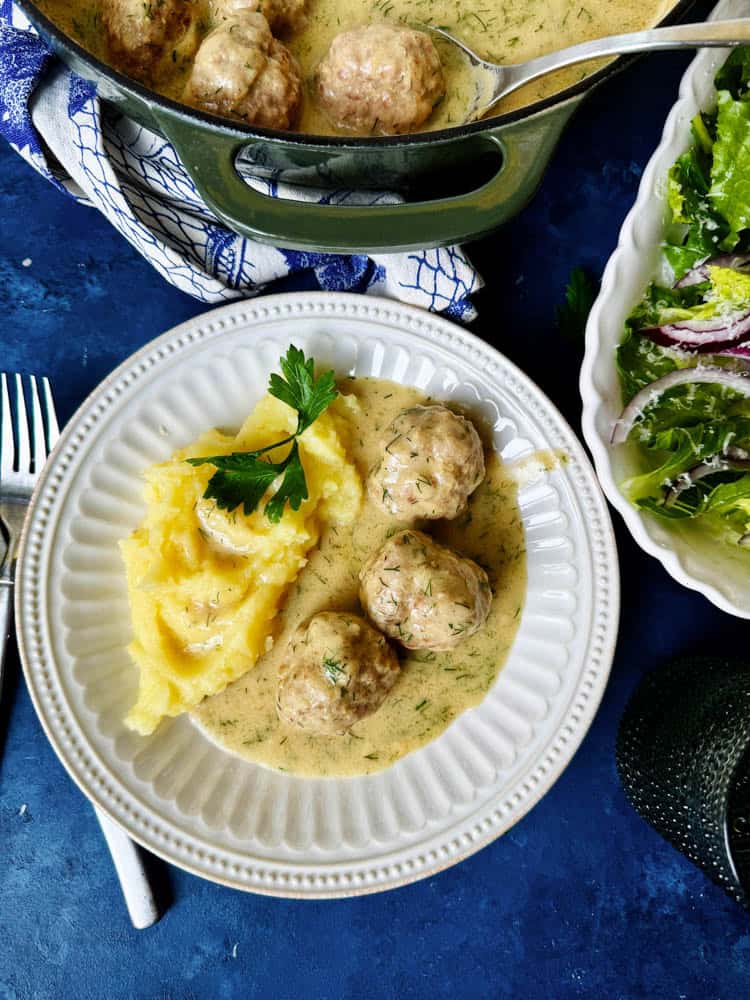 Overhead of boiled meatballs and mash potatoes