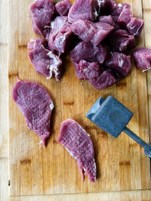 Tenderizing the pork tenderloin medallions