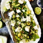 Overhead view of a platter of cucumber feta salad