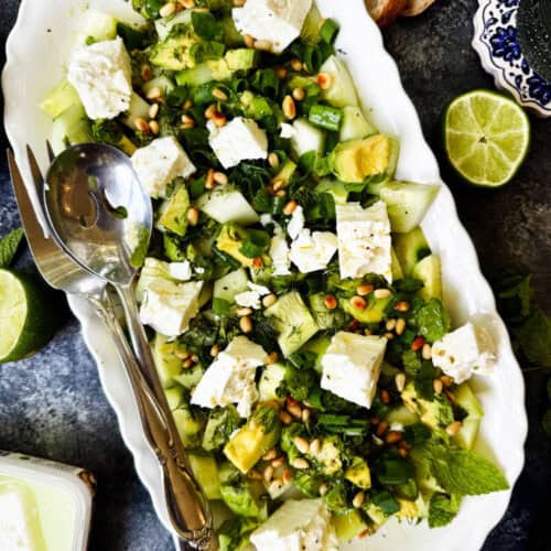 Overhead view of a platter of cucumber feta salad