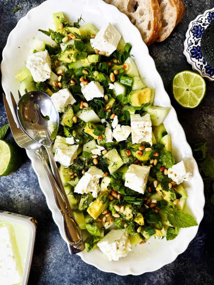 Overhead view of a platter of cucumber feta salad