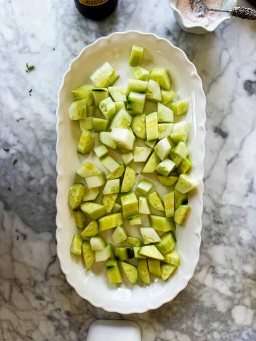 Cubed cucumber pieces on a serving plate