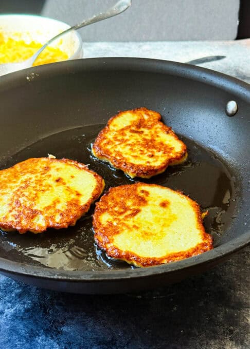Fry the potato pancakes until golden brown on both sides