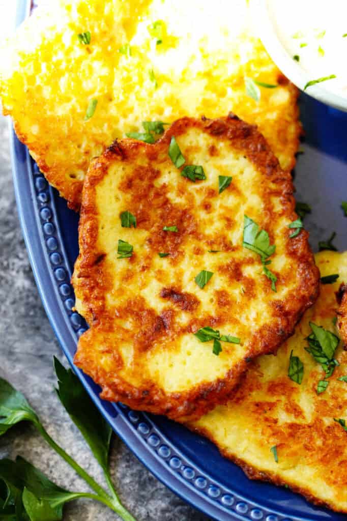 Closeup of German potato pancakes on a blue plate
