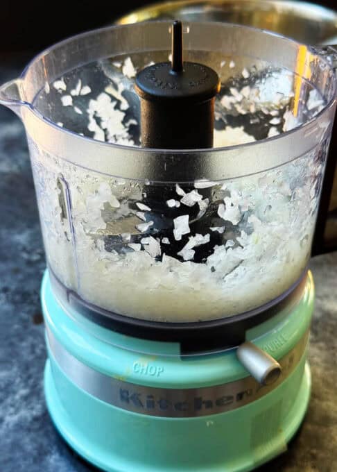 Onion being shopped up in a processor