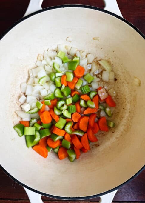 Onions, carrots, and celery in the pot