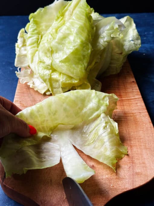 Trimming away the tough center ribs