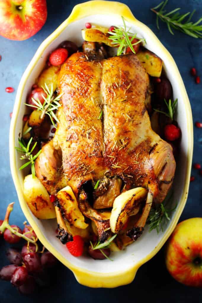 Overhead of roast duck stuffed with apples