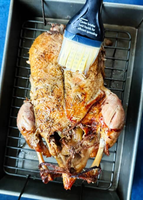 Brushing the duck with fat