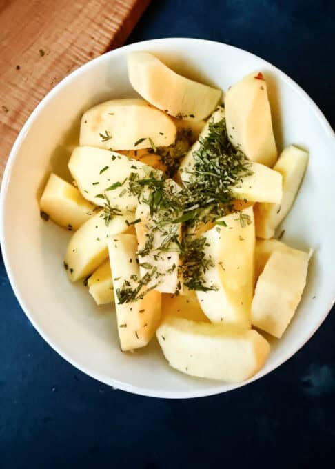 Rosemary and apples in a bowl